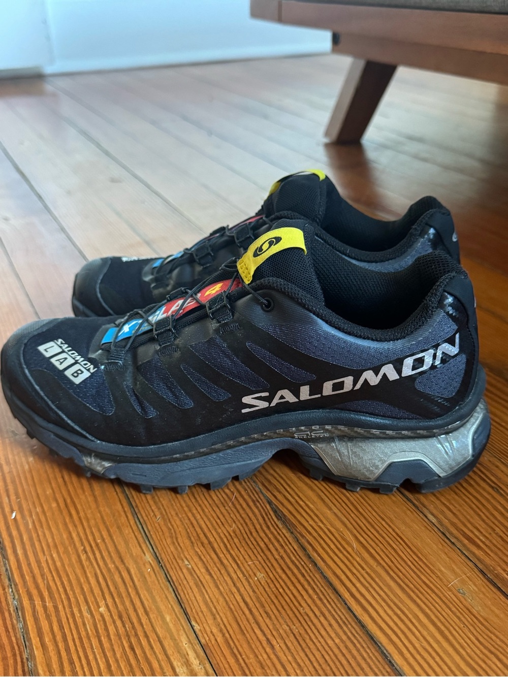 Salomon Black Trail Sneakers with Yellow and Blue Accents